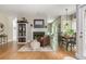 Bright open living room with fireplace, hardwood floors, and natural light at 690 Sienna Dr, Cumming, GA 30040