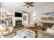 Bright living room features fireplace, open floorplan, and is perfect for gathering and entertaining at 690 Sienna Dr, Cumming, GA 30040