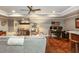 Inviting living room with comfortable seating, a ceiling fan, a home office area, and stylish decor at 690 Sienna Dr, Cumming, GA 30040