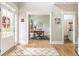 Open doorway leading to a well-lit home office with stylish decor and hardwood floors at 690 Sienna Dr, Cumming, GA 30040