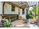 Outdoor patio with pergola, bar, seating, and grill at 690 Sienna Dr, Cumming, GA 30040
