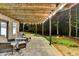 Covered back porch with a seating area, perfect for relaxing and enjoying the backyard at 1595 Northcliff Trce, Roswell, GA 30076