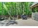 Wooden deck with a grill and wooded backyard at 1595 Northcliff Trce, Roswell, GA 30076