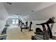 Spacious home gym equipped with weight machines, bench, punching bag, and treadmill at 1595 Northcliff Trce, Roswell, GA 30076