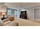Living room featuring recliners, a TV, windows, and a table lamp at 1595 Northcliff Trce, Roswell, GA 30076