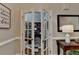 A glass door leads into an office with a bookcase wall at 1595 Northcliff Trce, Roswell, GA 30076