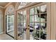 French doors open to the screened-in sunroom with outdoor seating at 1595 Northcliff Trce, Roswell, GA 30076