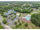 Aerial view of community amenities including a pool, tennis courts, playground and lake at 1721 Mulberry Lake Dr, Dacula, GA 30019