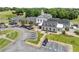 Aerial view of the community clubhouse, showcasing a well-maintained facade, solar panels, and ample parking at 1721 Mulberry Lake Dr, Dacula, GA 30019