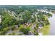 Aerial shot of the neighborhood homes featuring lush landscaping, and serene lake views at 1721 Mulberry Lake Dr, Dacula, GA 30019