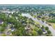 Community aerial showcasing lakeside living, manicured lawns, and verdant surroundings at 1721 Mulberry Lake Dr, Dacula, GA 30019