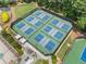 The aerial view reveals a community tennis court complex surrounded by lush landscaping at 1721 Mulberry Lake Dr, Dacula, GA 30019