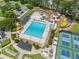 Recreational area with a large pool, slides, tennis courts, and lounge areas for community enjoyment at 1721 Mulberry Lake Dr, Dacula, GA 30019