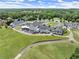 Elevated view of the club house and golf course, showcasing a picturesque setting for a relaxing day of golf at 1721 Mulberry Lake Dr, Dacula, GA 30019