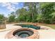 Stunning backyard oasis with a custom-designed pool, spa, and waterfall feature for a luxurious outdoor living experience at 1721 Mulberry Lake Dr, Dacula, GA 30019