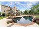 Beautiful backyard pool with a large deck, hot tub, and lush landscaping, creating a private and relaxing retreat at 1721 Mulberry Lake Dr, Dacula, GA 30019