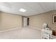 Spacious finished basement area with neutral walls and carpet, recessed lighting, and furniture at 1721 Mulberry Lake Dr, Dacula, GA 30019