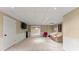 Finished basement area with neutral walls and carpet, wainscoting, recessed lighting, a tv, and two sofas at 1721 Mulberry Lake Dr, Dacula, GA 30019