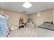 Finished basement area with neutral walls and carpet, recessed lighting, a sink, a counter, and some storage shelves at 1721 Mulberry Lake Dr, Dacula, GA 30019