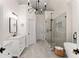 Spa-like primary bathroom with a glass-enclosed shower, soaking tub, dual vanities, and modern fixtures at 1721 Mulberry Lake Dr, Dacula, GA 30019