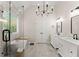 This bathroom has dual vanities, a standalone tub, and an expansive shower at 1721 Mulberry Lake Dr, Dacula, GA 30019
