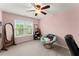 Bright bedroom with a large window, comfortable furnishings, and neutral carpeting at 1721 Mulberry Lake Dr, Dacula, GA 30019