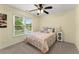 Bright bedroom with large window, ceiling fan, and ample natural light at 1721 Mulberry Lake Dr, Dacula, GA 30019