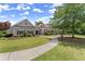 Clubhouse exterior with sidewalk, lush lawn and landscaping at 1721 Mulberry Lake Dr, Dacula, GA 30019