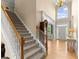 Elegant foyer with hardwood floors, staircase, and natural light at 1721 Mulberry Lake Dr, Dacula, GA 30019