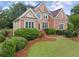 Charming brick home with manicured lawn and professional landscaping at 1721 Mulberry Lake Dr, Dacula, GA 30019