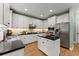 Updated kitchen with white cabinets, stainless steel appliances, and a center island at 1721 Mulberry Lake Dr, Dacula, GA 30019