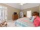 Comfortable main bedroom with tray ceiling, neutral walls, and a door to a private balcony at 1721 Mulberry Lake Dr, Dacula, GA 30019