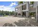 Outdoor seating area with fireplace and views of a pool and tennis courts at 1721 Mulberry Lake Dr, Dacula, GA 30019