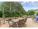 Inviting outdoor deck with stylish furniture, perfect for al fresco dining and overlooking the beautiful pool area at 1721 Mulberry Lake Dr, Dacula, GA 30019