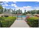 Community pool featuring a water slide, covered lounge areas and a gated entrance at 1721 Mulberry Lake Dr, Dacula, GA 30019