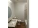 Bathroom featuring a single vanity, toilet, and bathtub with tiled walls at 2041 Olive Springs Rd, Marietta, GA 30060