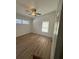 This bedroom features wood-look floors, bright natural light and a ceiling fan at 2041 Olive Springs Rd, Marietta, GA 30060