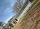 Single story home featuring neutral gray tones and a well maintained yard at 2041 Olive Springs Rd, Marietta, GA 30060
