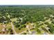 Expansive aerial view of a neighborhood featuring mature trees and well-maintained lawns at 282 Oak Rdg, Auburn, GA 30011