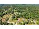 Aerial view of a house in a neighborhood with many trees at 282 Oak Rdg, Auburn, GA 30011