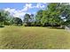An empty backyard with a large, grassy lot at 282 Oak Rdg, Auburn, GA 30011