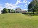View of back of home and spacious green lawn at 282 Oak Rdg, Auburn, GA 30011