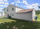An ample backyard with a large house and garage in the background at 282 Oak Rdg, Auburn, GA 30011