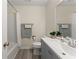 Bathroom featuring a shower/tub combo, large mirror, and modern vanity at 282 Oak Rdg, Auburn, GA 30011