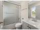 Bathroom with shower-tub combo, vanity sink, and grey cabinets at 282 Oak Rdg, Auburn, GA 30011