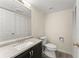 Bathroom featuring a vanity with granite countertop and full wall mirror at 282 Oak Rdg, Auburn, GA 30011