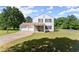 Charming two-story home featuring a spacious three-car garage and welcoming stone-accented entryway at 282 Oak Rdg, Auburn, GA 30011