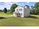 View of the home featuring a well-maintained lawn, inviting porch, and classic architecture at 282 Oak Rdg, Auburn, GA 30011