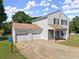 Charming two-story home with a spacious driveway and an attached two-car garage at 282 Oak Rdg, Auburn, GA 30011