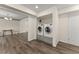 Modern washer and dryer closet with hardwood floors at 282 Oak Rdg, Auburn, GA 30011